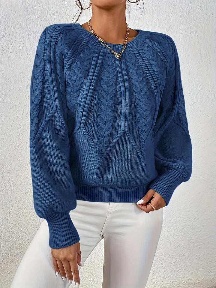 Maglia da donna con trecce e maniche a palloncino. Un capo comodo e alla moda.