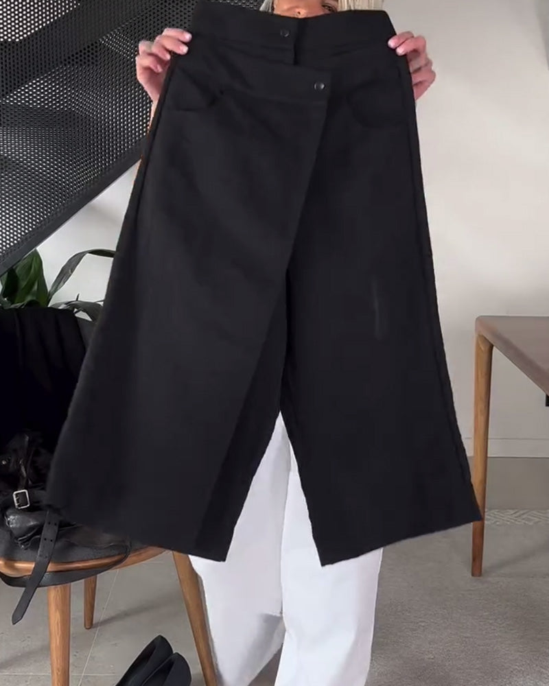 Pantaloni donna asimmetrici neri, vita media, offrono comfort e stile per ogni occasione.