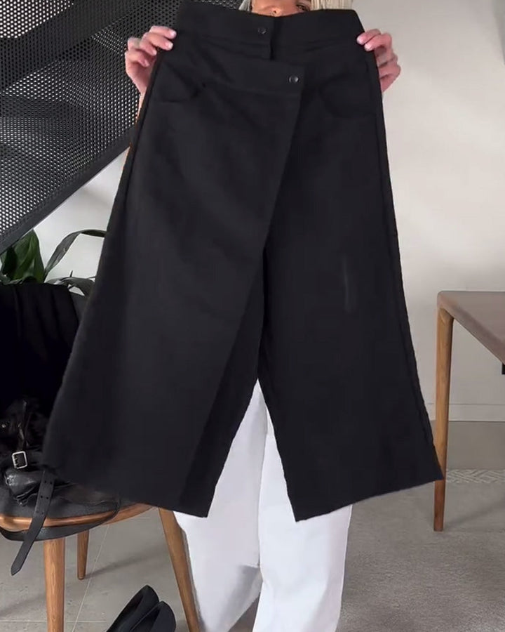 Pantaloni donna asimmetrici neri, vita media, offrono comfort e stile per ogni occasione.