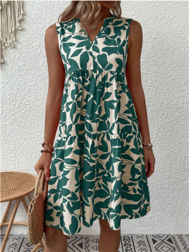 Abito estivo floreale midi da donna, svasato e leggero, perfetto per eleganza casual primaverile.