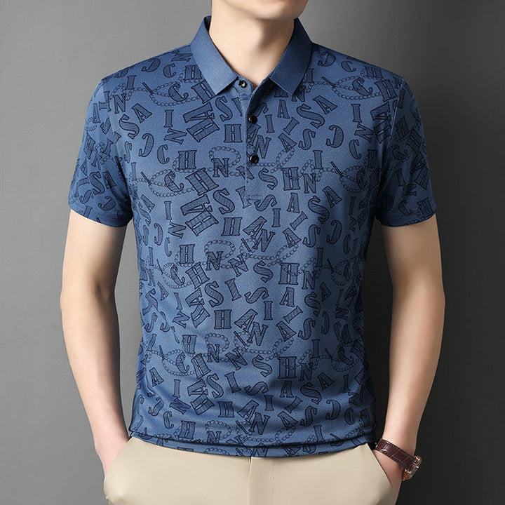 Polo uomo verde smeraldo con pattern floreale e taglio slim fit, moda estiva maschile.