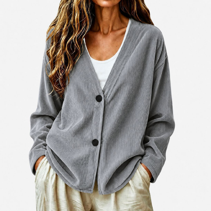 Comodo cardigan donna a coste, scollo a V e bottoni. Perfetto per il relax e un tocco elegante.