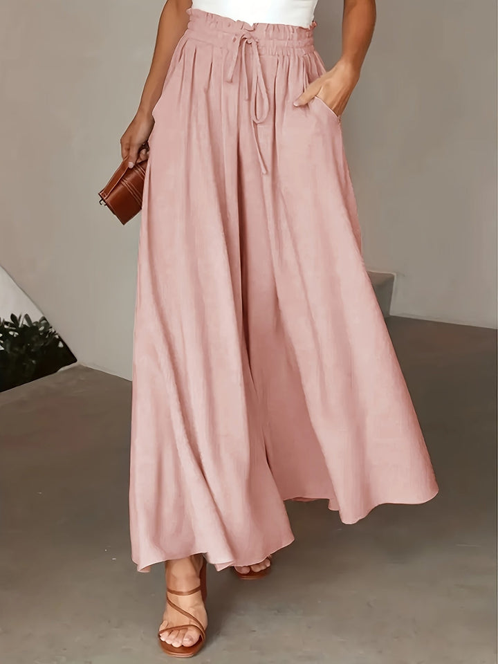 Pantaloni palazzo donna confortevoli, gamba larga, vita alta, ideali per un look casual estivo.