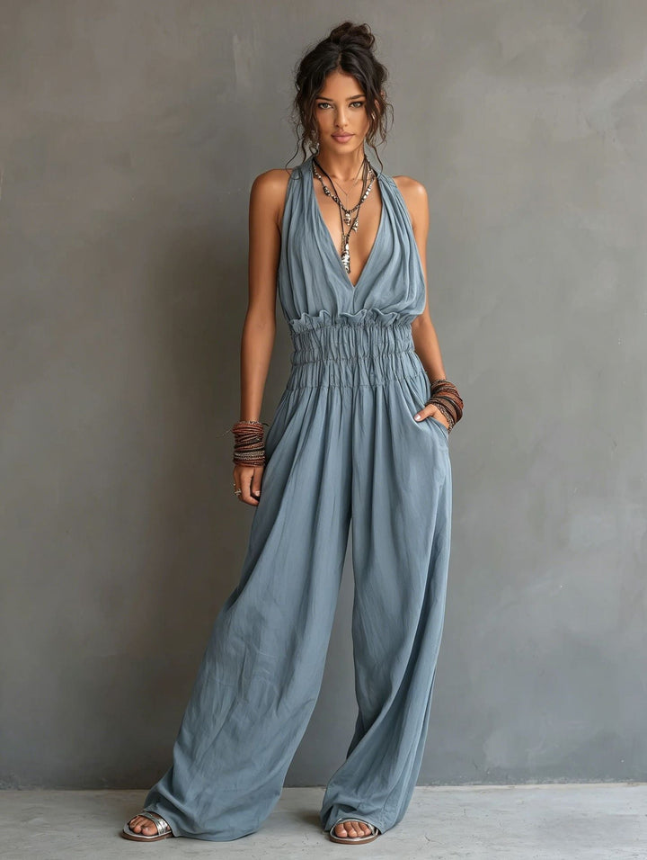 Outfit estivo casual chic: tuta elegante donna con scollo a V e pantaloni larghi, comoda e alla moda.