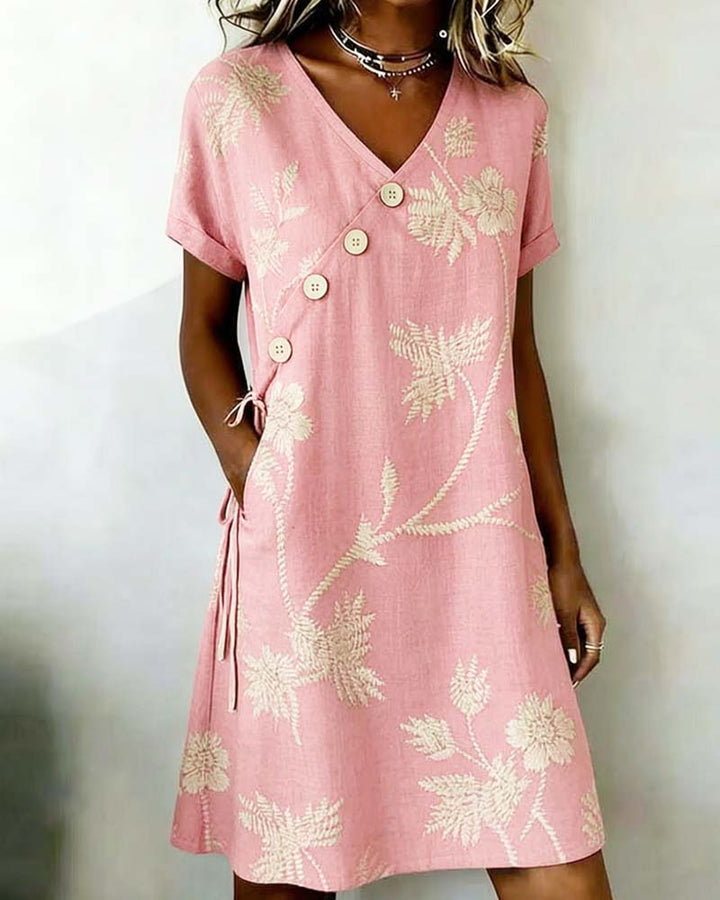 Abito donna elegante casual con motivo floreale e scollo a V, outfit perfetto per la bella stagione.