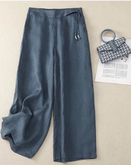 Pantaloni donna in lino versatili a vita alta con gamba larga e tasche, perfetti per outfit primavera estate.