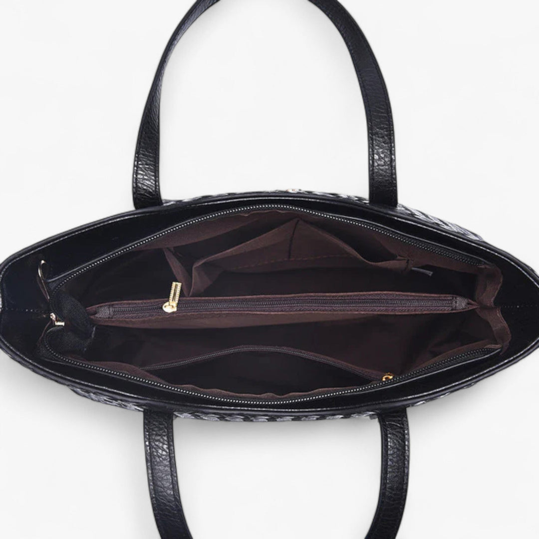 Borsa a spalla nera intrecciata del set, pratica ed elegante, ideale per un look versatile da donna.