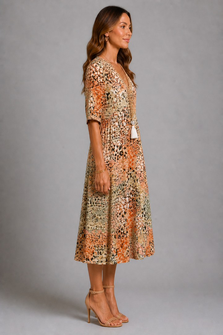 Vestito estivo donna beige dal taglio fluido, luminoso e versatile per un look casual chic. Eleganza e comfort.