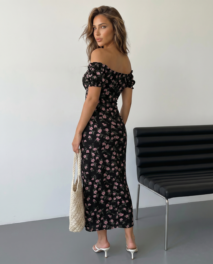 Abito donna maxi floreale con scollo a spalle scoperte, design fluido, ideale per eventi estivi eleganti e romantici.