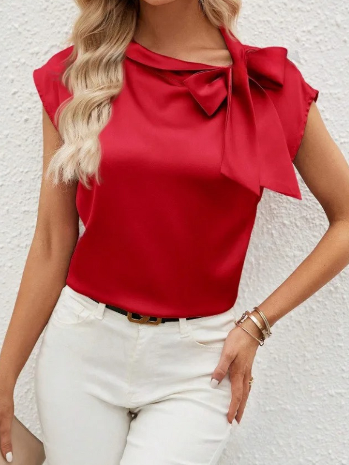 Blusa elegante da donna, con fiocco e taglio moderno, perfetta per un look sofisticato.