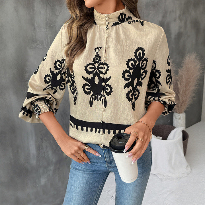 Blusa donna a maniche lunghe con affascinante stampa etnica e maniche a lanterna. Perfetta per look casual e moda etnica.