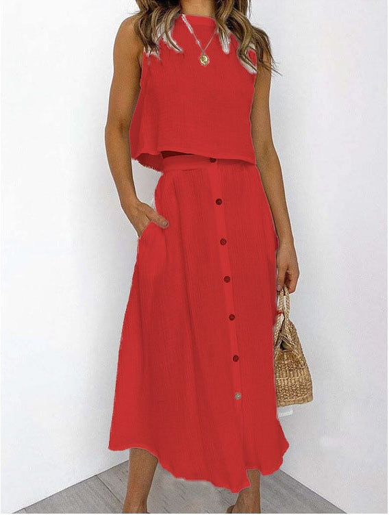 Moda femminile: completo due pezzi casual con gilet e abito midi stampato. Look versatile e confortevole.