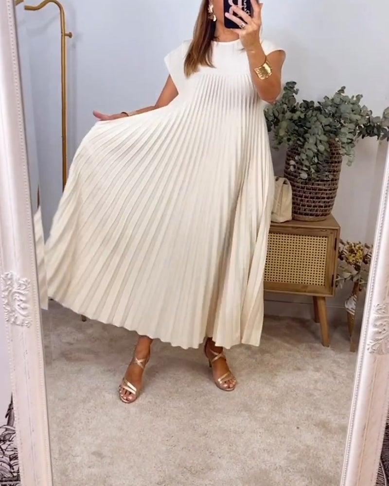 Vestito estivo plissettato da donna, modello maxi, leggero e fluido per eleganza quotidiana.