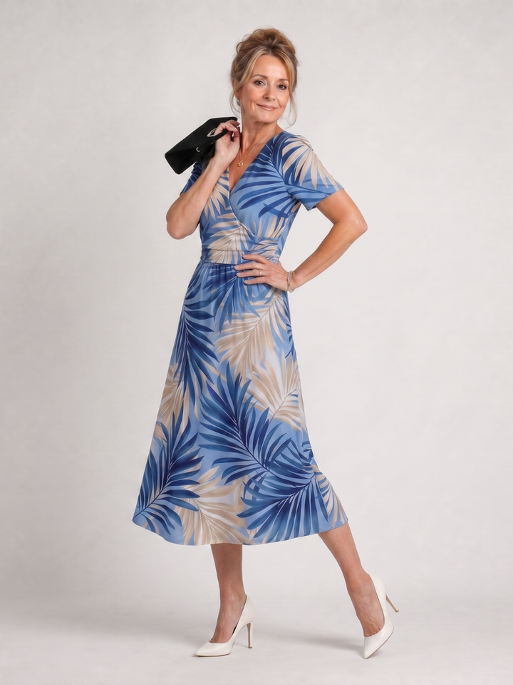 Abito floreale midi da donna, ideale per l'estate e le vacanze. Design fluido con scollo a V.