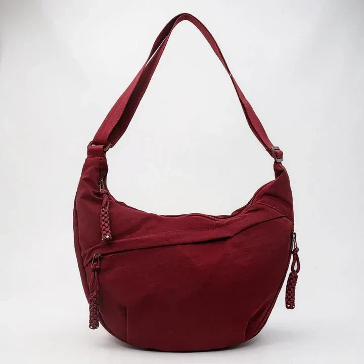 Elegante borsa a tracolla da donna in nylon resistente con tasche esterne e interne con zip.