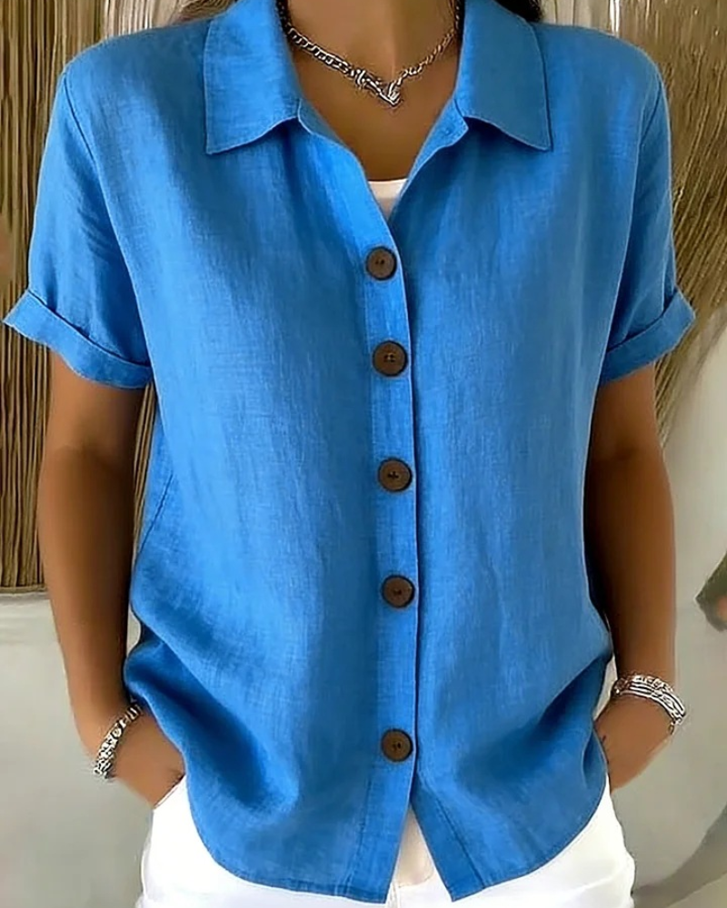 Blusa donna elegante a maniche corte con bottoni, perfetta per la moda primavera estiva.