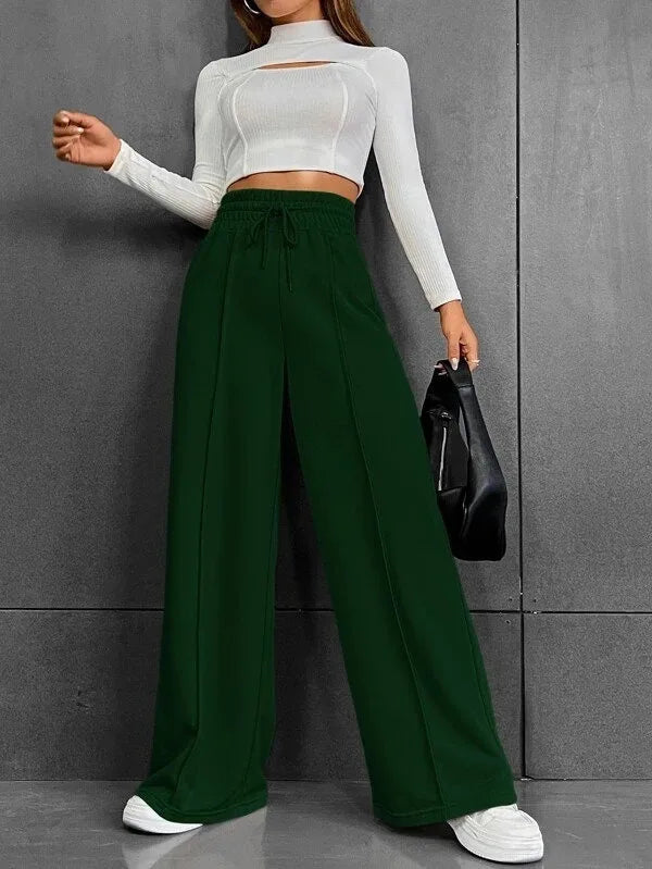 Pantaloni casual chic donna, vita alta e gamba larga, essenziali per la moda primavera/estate.