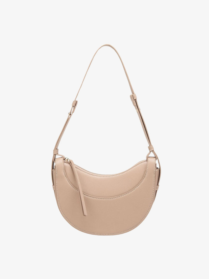 Accessorio donna: borsa a tracolla curva elegante con nappina, per un tocco di stile quotidiano.