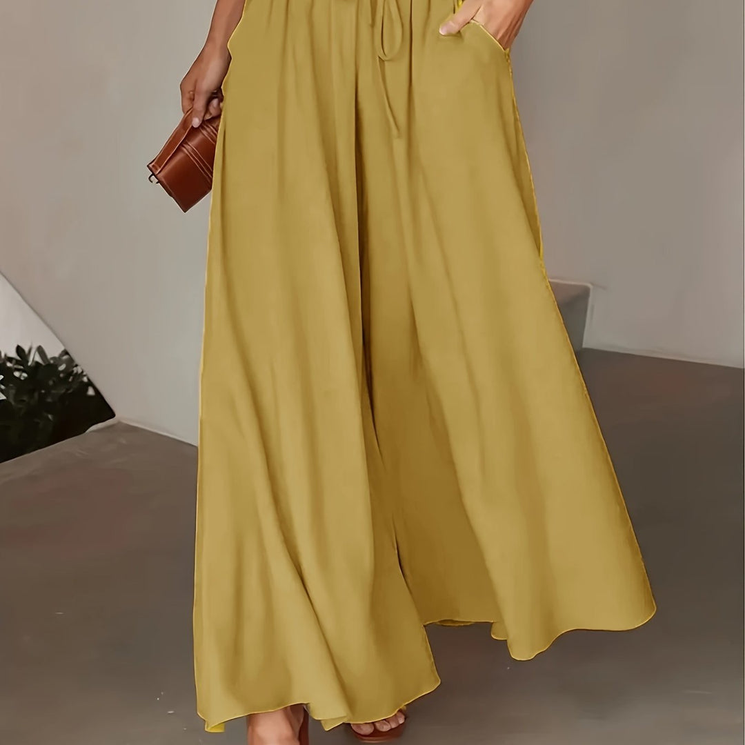 Look estivo con pantaloni palazzo donna a vita alta, gamba larga, stile elegante e rilassato.