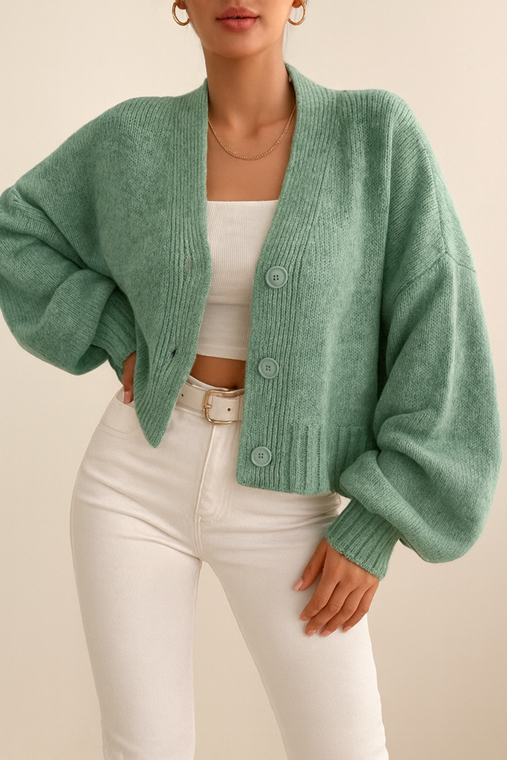 Cardigan corto donna con scollo a V e maniche a palloncino, un capo autunnale di tendenza. [[lstfy-media:4]]