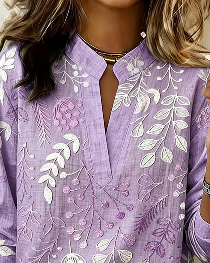 Top donna floreale a maniche tre quarti con scollo a V, tessuto leggero. Ideale per l'estate e il comfort.