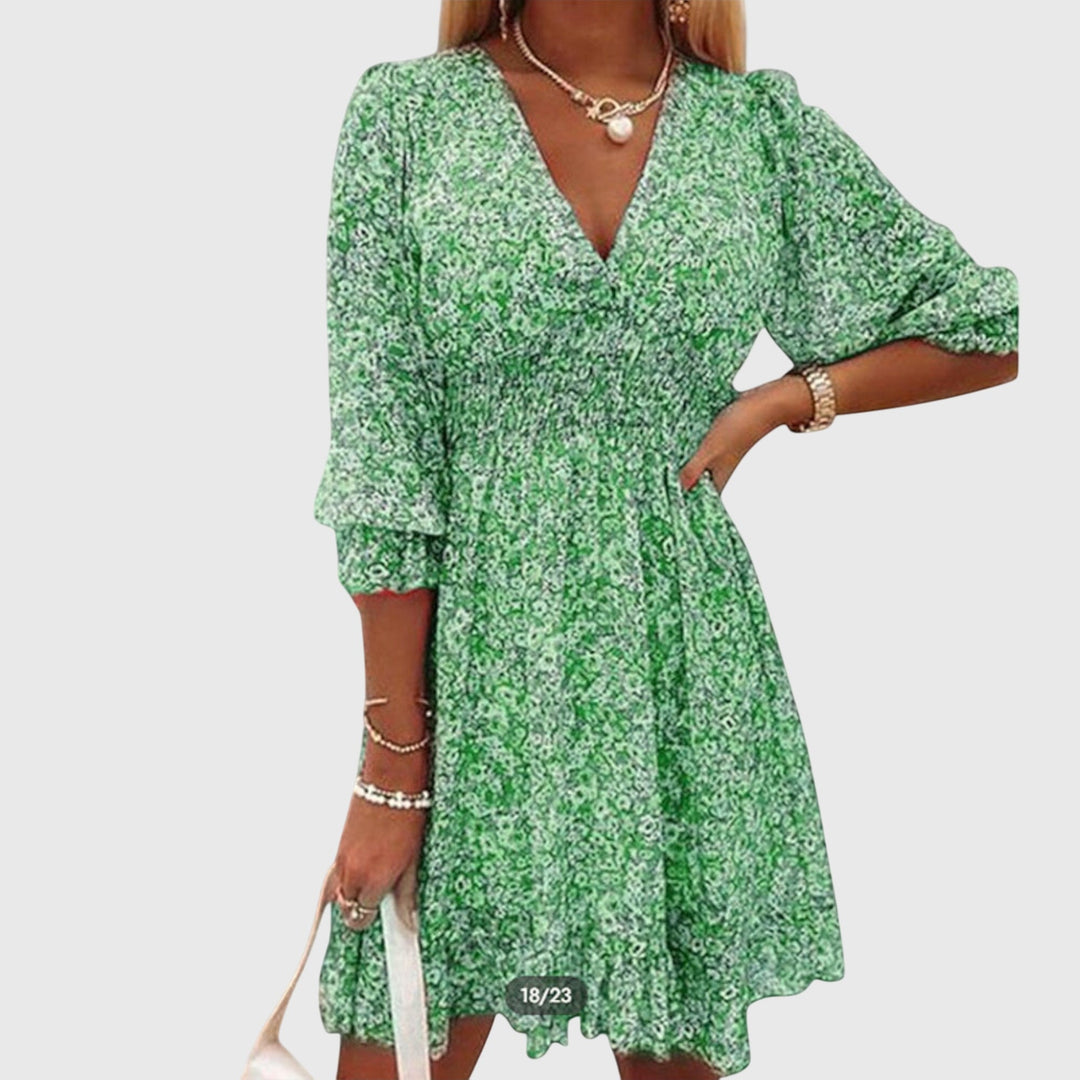 Elegante abito floreale estivo per donna, con maniche a sbuffo e scollo a V profondo.