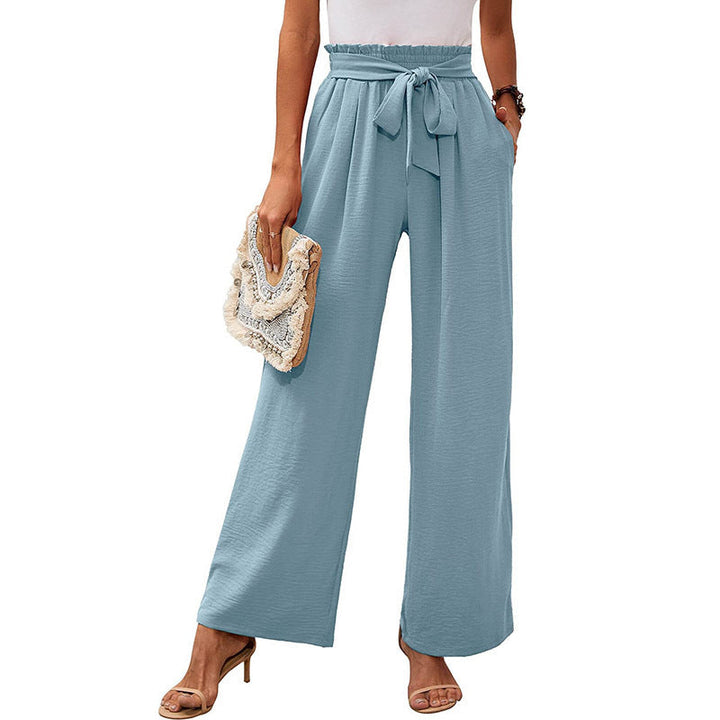 Pantaloni donna trendy: vita alta con nodo, gamba ampia. Perfetti per un look casual estivo.