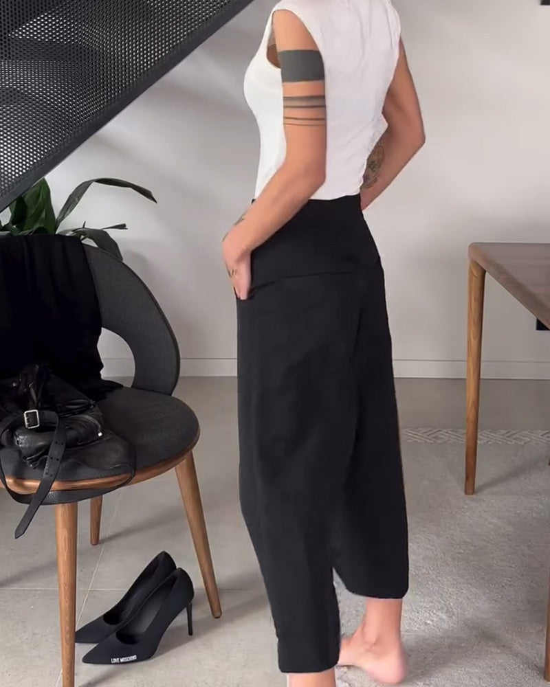 Moda pantaloni larghi asimmetrici neri donna, versatili per primavera/estate e autunno/inverno.