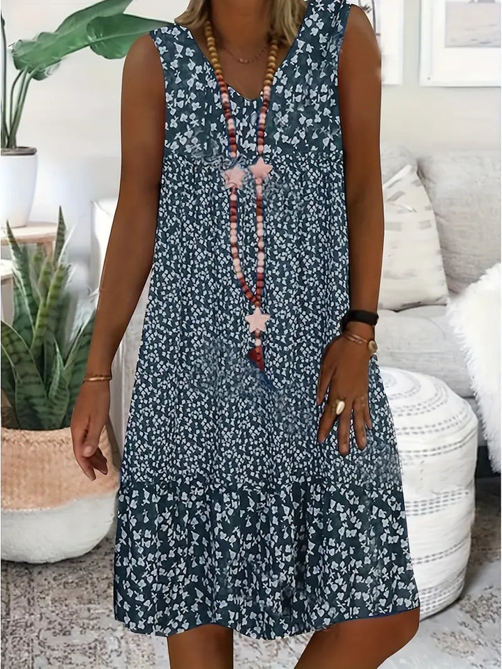 Vestito midi casual floreale senza maniche per donna, ideale per l'estate, leggero e fresco.