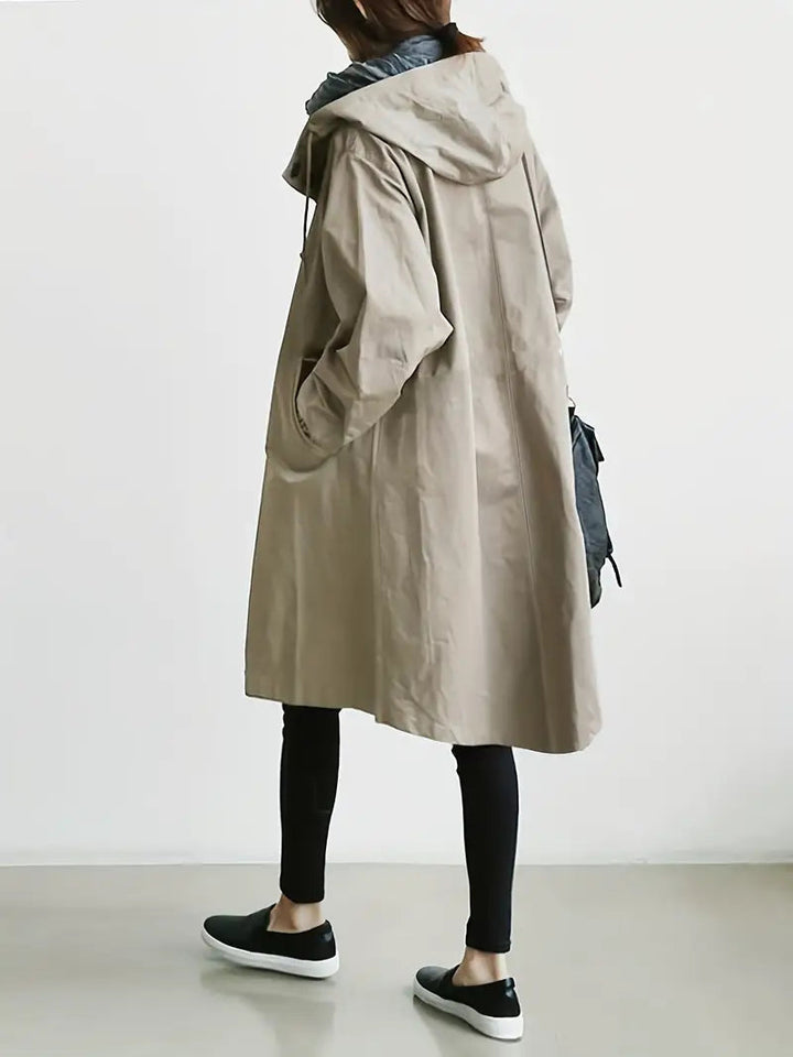 Trench donna impermeabile autunnale, giacca con cappuccio e polsini regolabili, perfetta per la pioggia.