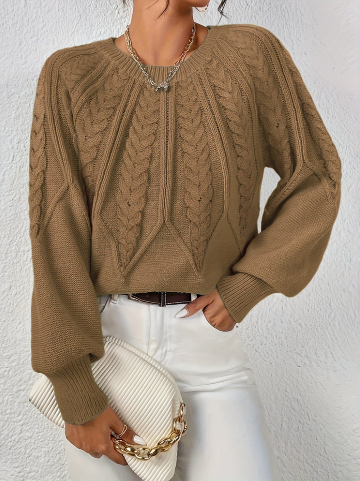 Trecce classiche e maniche a palloncino: maglione donna comodo e alla moda.