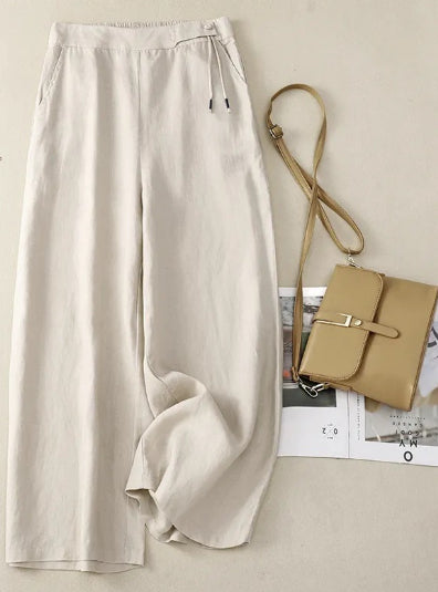 Pantaloni donna ampi in lino a vita alta con gamba larga, vestibilità comoda e pratiche tasche.
