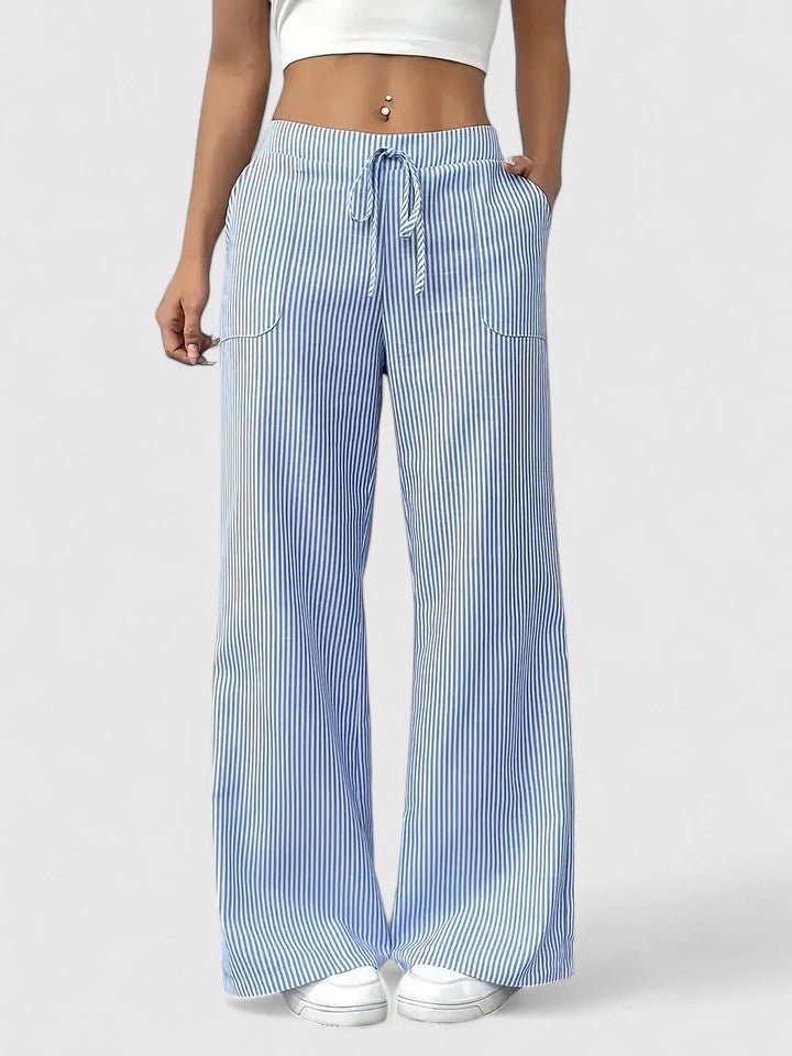 Pantaloni donna moderni, gamba larga, vita alta con laccio regolabile. Comfort e stile per ogni occasione.