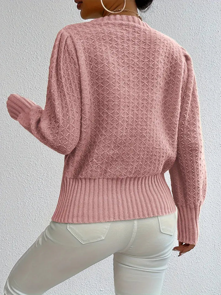 Maglione donna elegante con maniche a sbuffo, stile lavorato a maglia. Perfetto per outfit casual e chic.