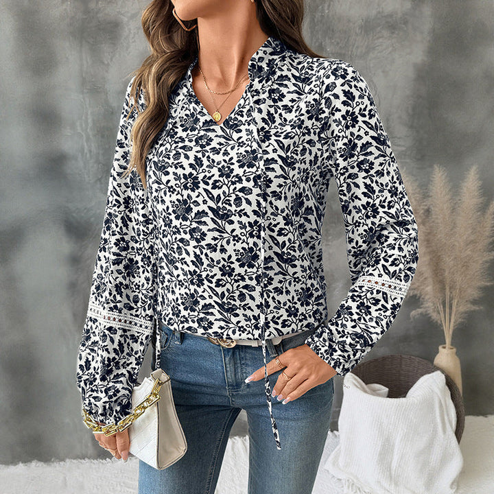 Pullover donna elegante a V con delicata stampa floreale, maniche a lanterna. Ideale per la moda femminile.