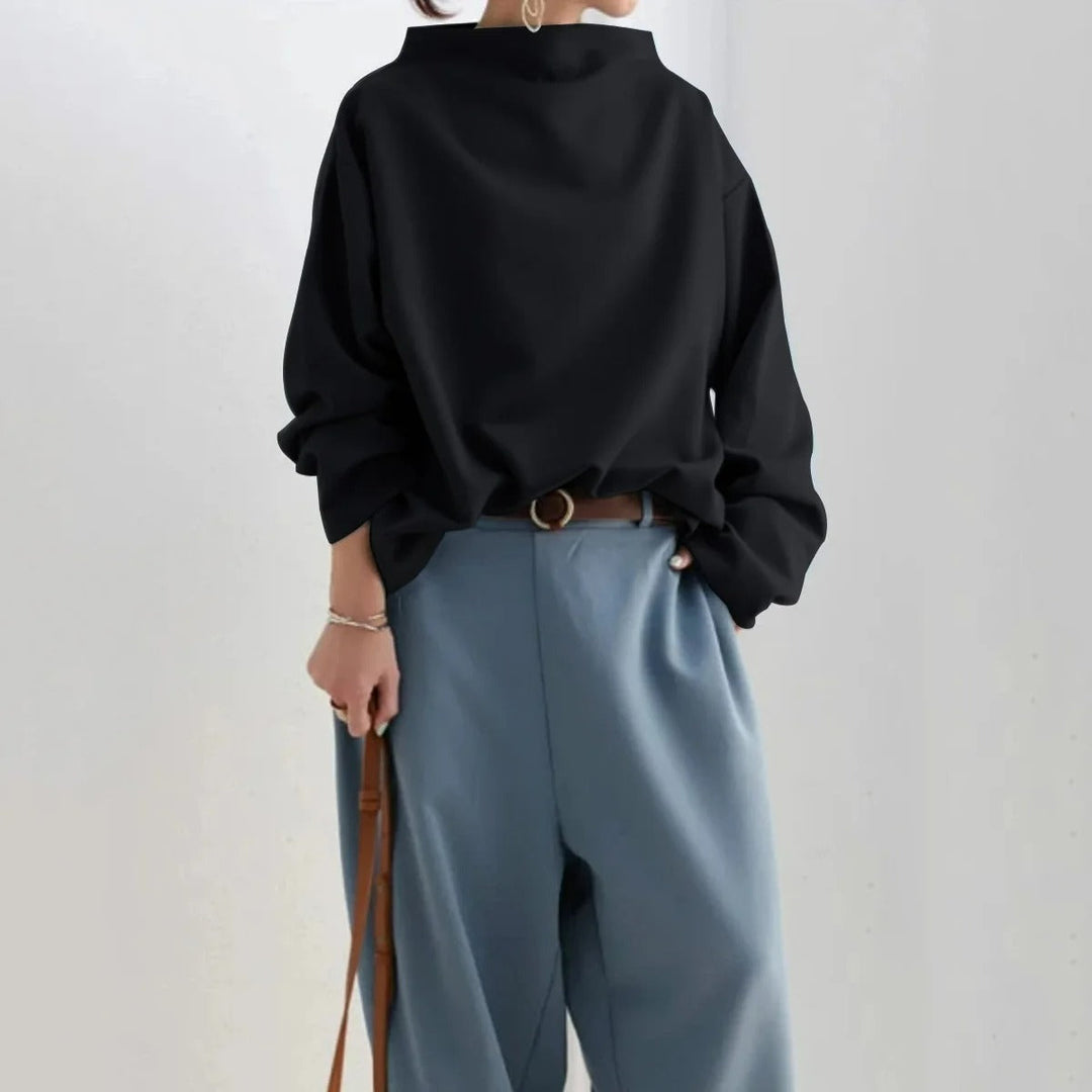Maglione a collo alto nero donna, in morbida maglieria casual. Abbigliamento femminile comodo e chic.
