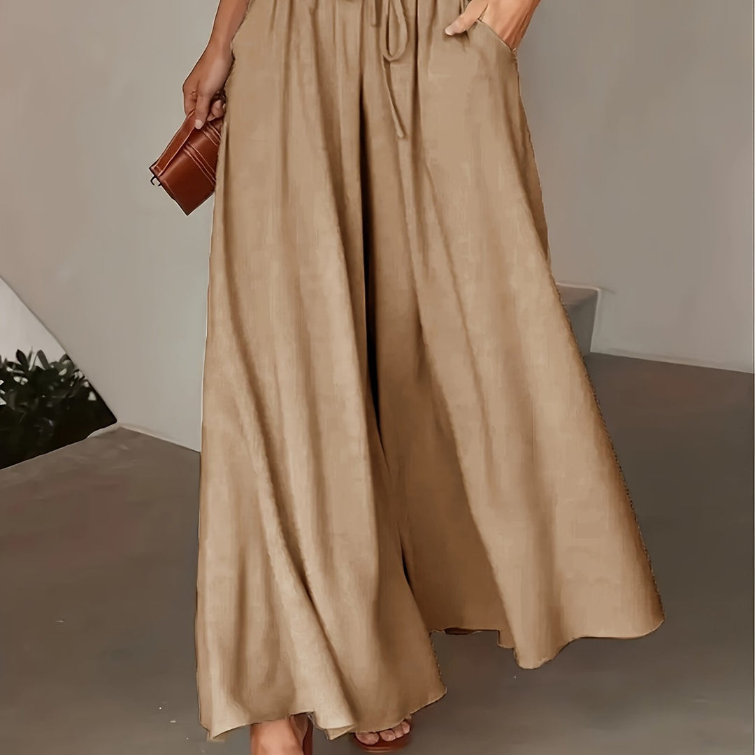 Pantaloni donna a vita alta, stile boho per un outfit casual chic di tendenza, gamba ampia.