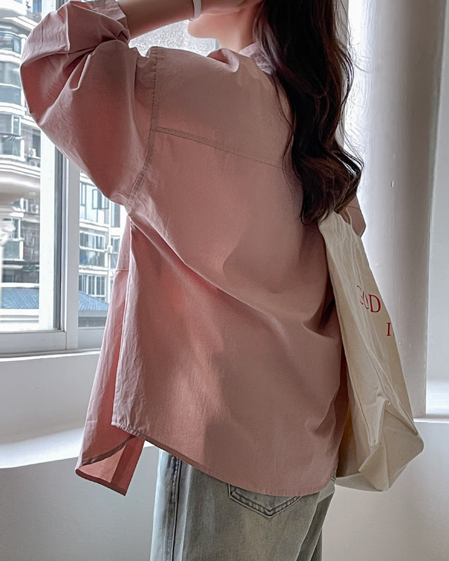 Elegante camicia donna manica lunga rosa, vestibilità oversize per comfort e stile.