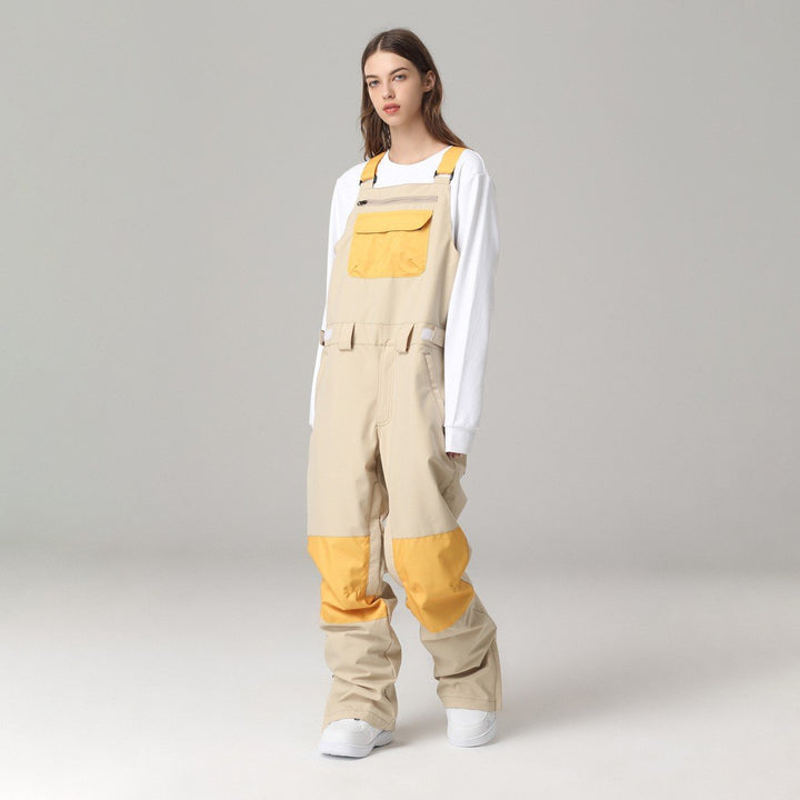 Salopette sci uomo/donna, design color block con bretelle regolabili per protezione sulla neve.