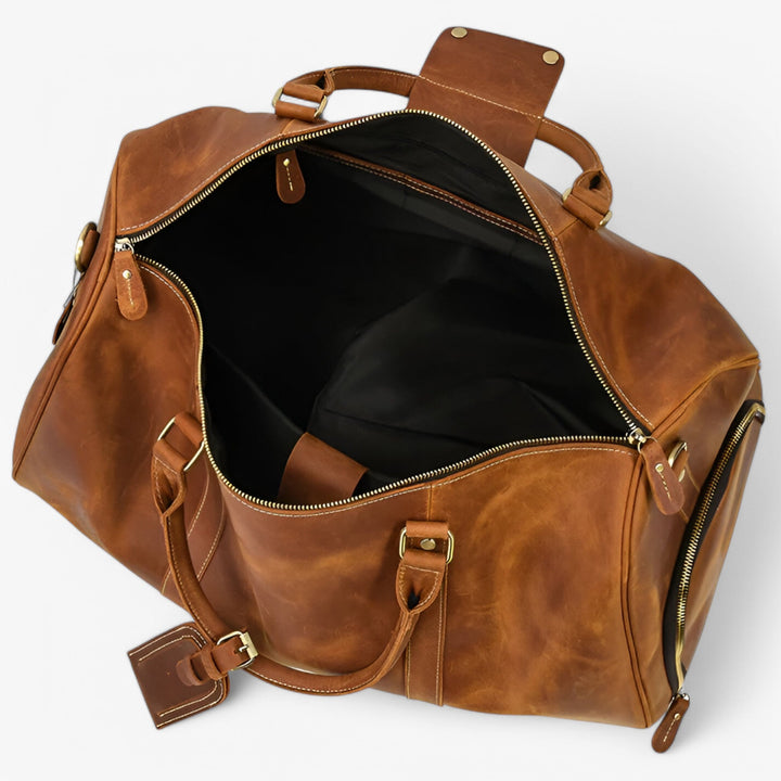 Elegante borsa da viaggio marrone, capiente e unisex, con tracolla per viaggi confortevoli.