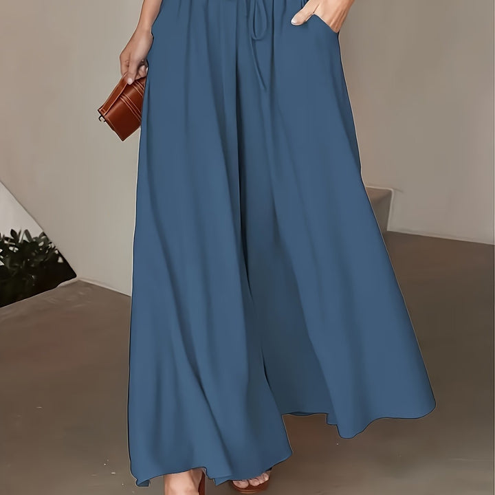 Pantaloni donna a vita alta con gamba ampia, perfetti per un outfit casual primaverile.