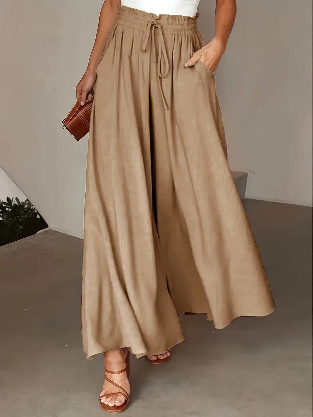 Pantaloni palazzo donna a vita alta neri, ampi e comodi, perfetti per l'estate, stile boho chic.