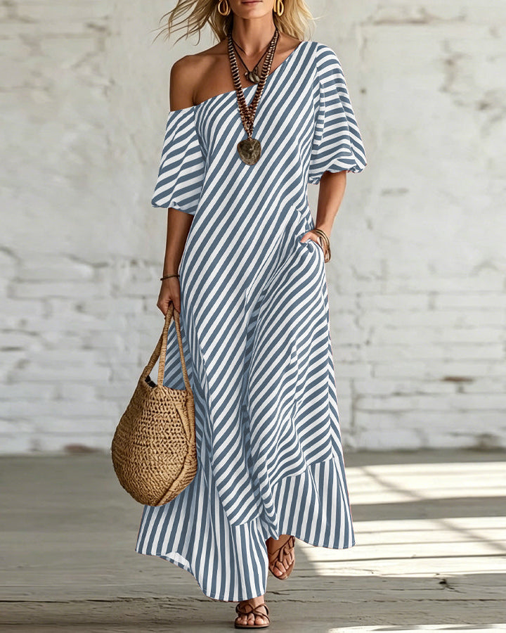 Abito lungo monospalla donna con volant, a righe classiche. Perfetto per outfit estivi comodi e alla moda.