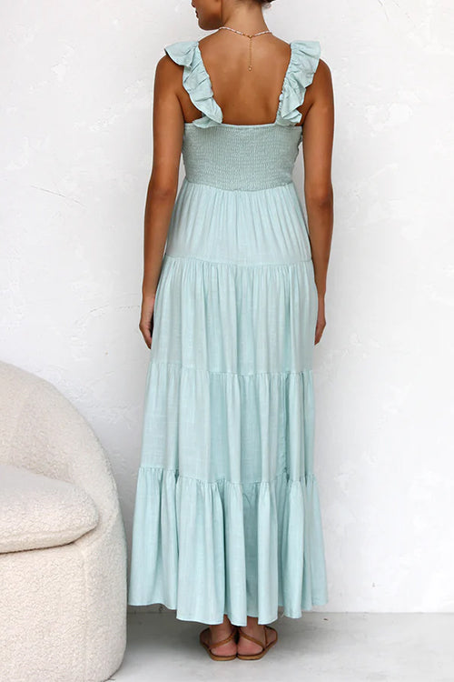 Abito da donna elegante con scollo a V profondo e balze vaporose. Un maxi abito perfetto per eventi estivi.