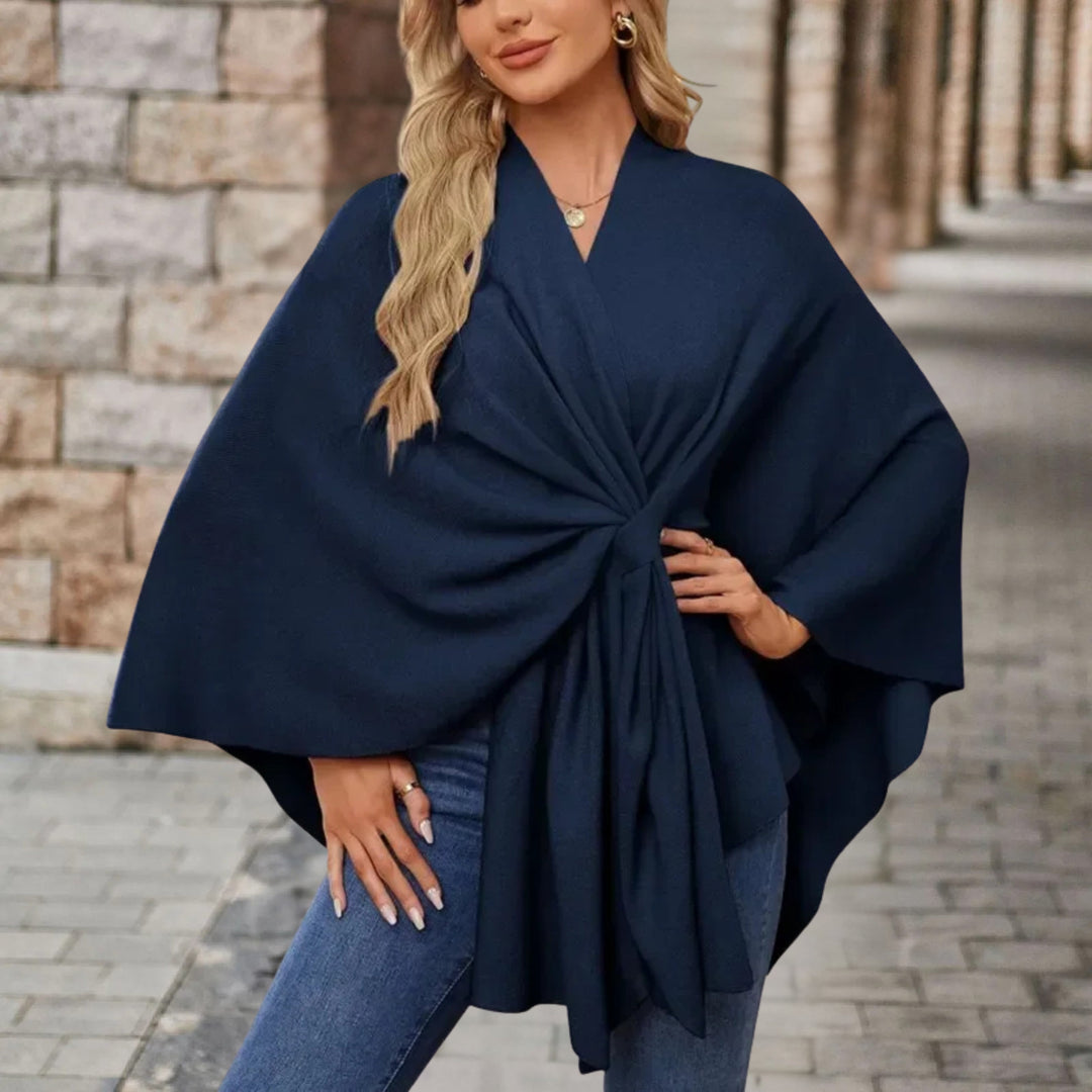 Poncho donna elegante con fiocco decorativo. Perfetto per un tocco chic e confortevole al tuo stile.