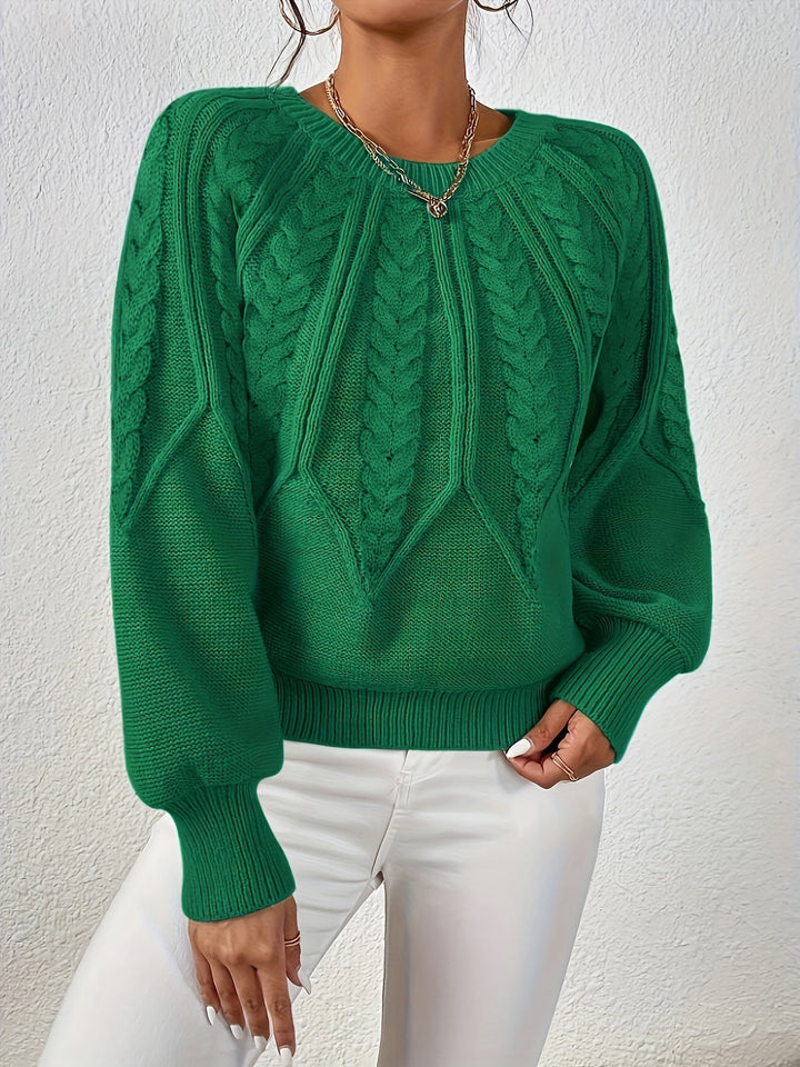 Maglione autunnale donna a trecce, maniche a palloncino. Calore e stile distintivo.