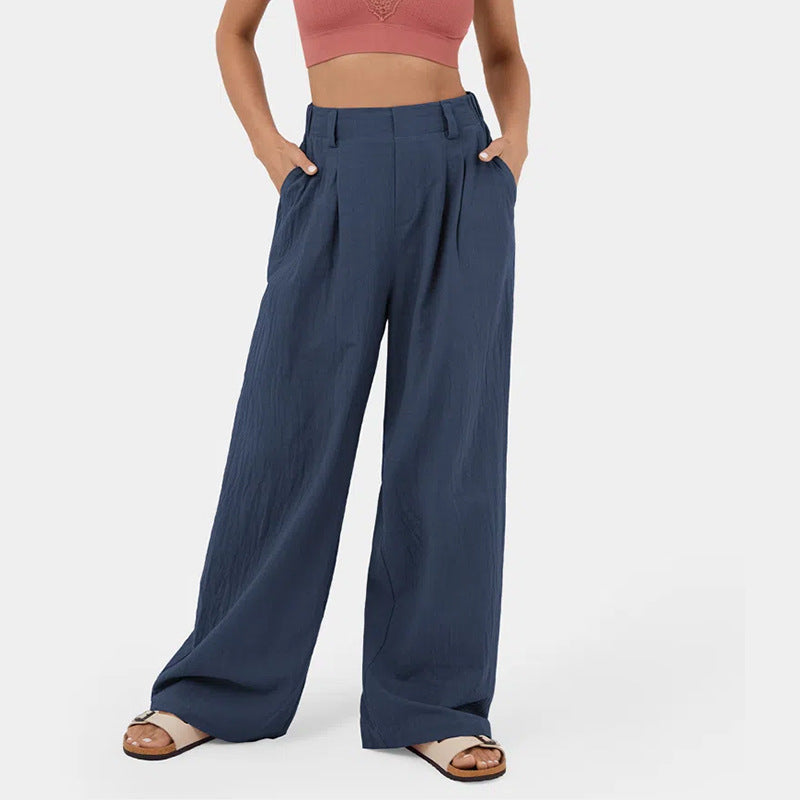 Versatili pantaloni donna con gamba larga, vita alta e tasche, perfetti per look giorno/sera.