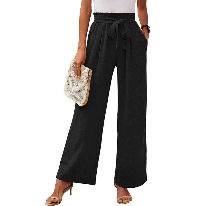 Texture e nodo dei pantaloni donna eleganti vita alta. Gamba ampia e comfort.
