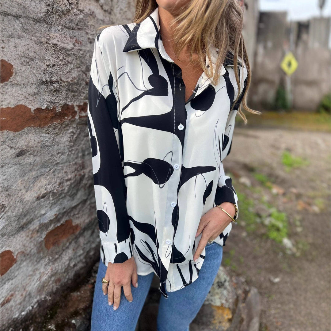 Camicia donna manica lunga con elegante stampa effetto 3D. Perfetta per moda femminile casual o chic, outfit autunnale.