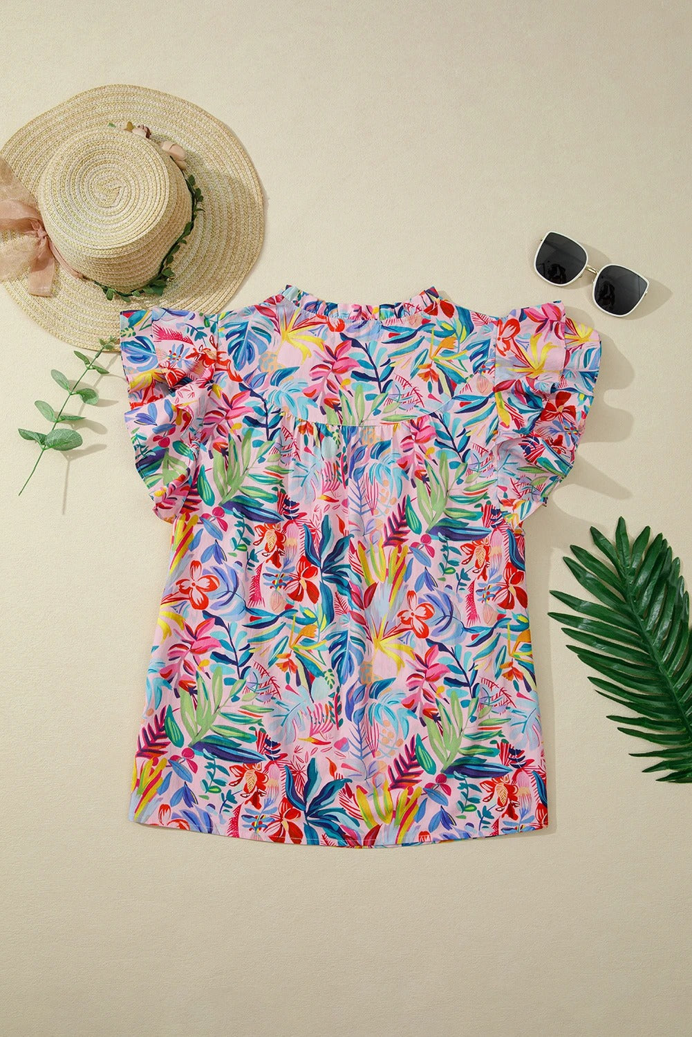 Top rosa stampato da donna in chiffon, con maniche arricciate. Abbigliamento femminile elegante e versatile per l'estate.